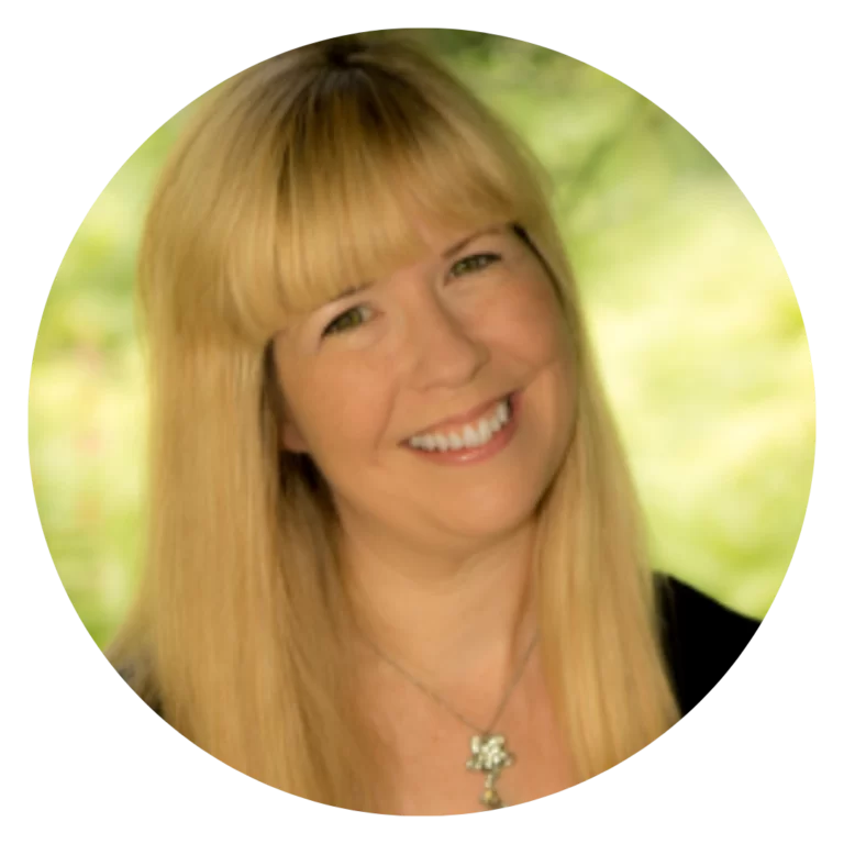 Smiling elementary music teacher with long blonde hair, headshot on soft green background